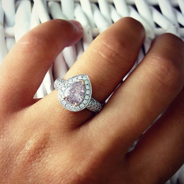 pink diamond ring on finger